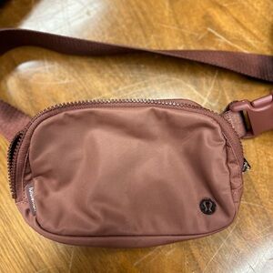 Lululemon Belt Bag in a mauve. Used about two times.
